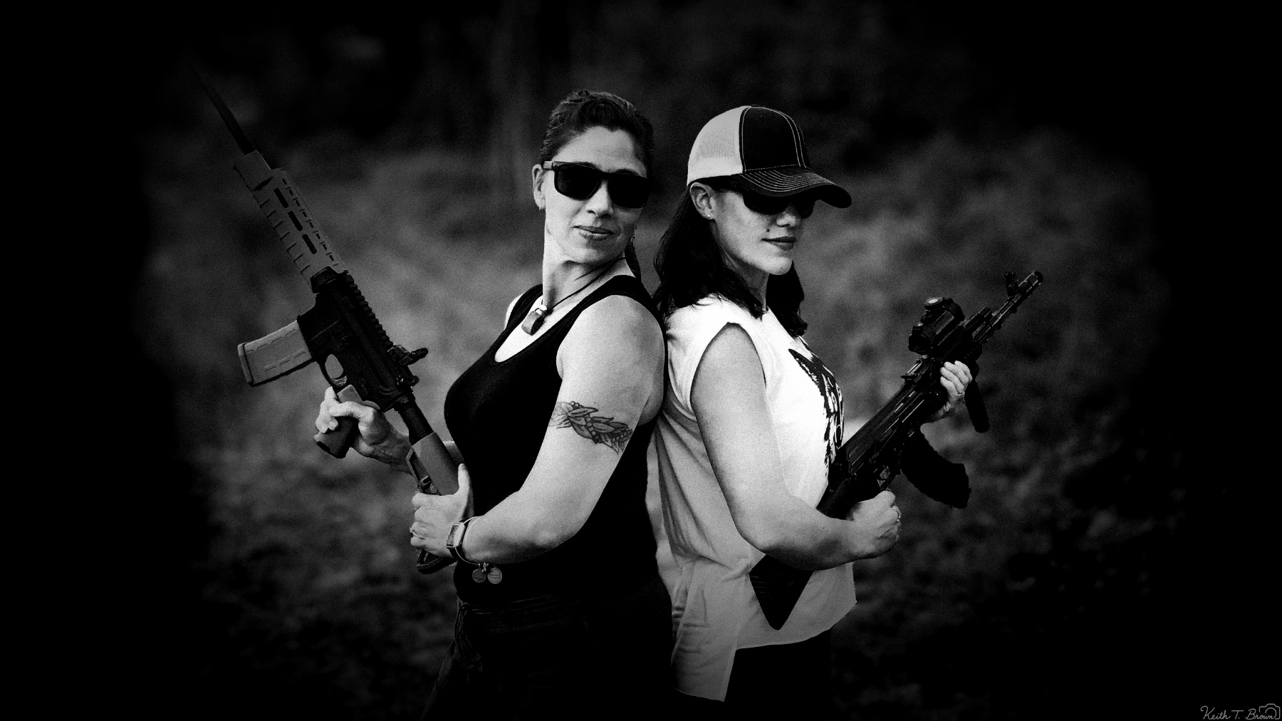 Two People Posing Back-to-Back with Rifles