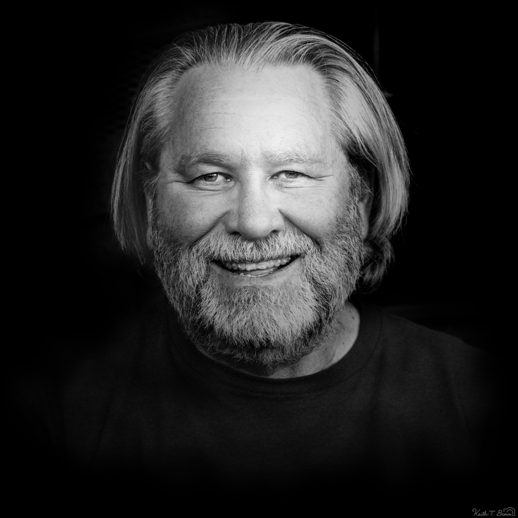 Black and White Portrait of a Smiling Older Man